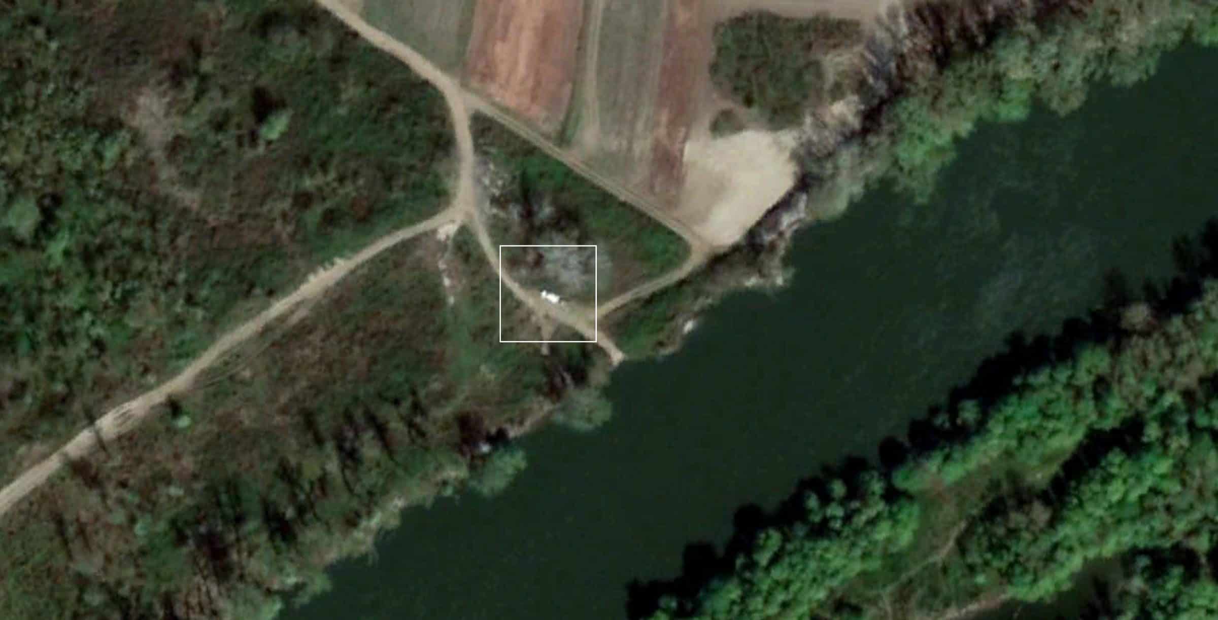 White Car at the Location, 30 March 2019 - A white car similar to the one used in the pushback depicted in a satellite photo of the same location, 30 March 2019. (Image courtesy of Google Earth)