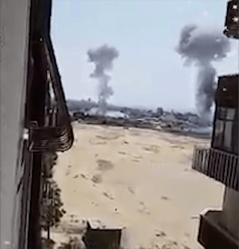 Gaza Arch_Image 10 - Fig. 19 - Smartphone clip filmed by Palestinians during the 2018 Israeli military incursion, shows bombs landing on the surface above the site.  Image: Shehab News Agency Twitter (@ShehabAgency), 29 May 2018