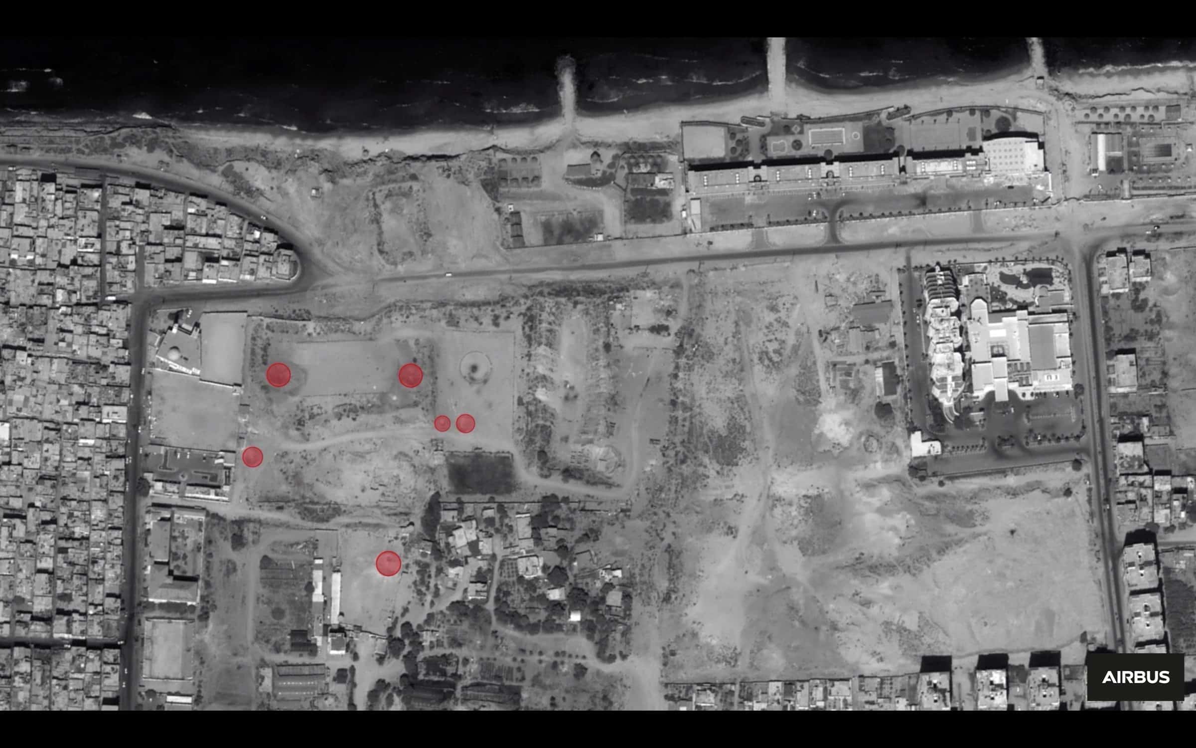Gaza Arch_Image 11_2014 - Fig. 22 - Analysis of a 2014 satellite image (red circles indicate bomb craters or other evidence of damage). Image: Forensic Architecutre, 2022. Satellite image © CNES 2018 Distribution Airbus DS/Spot Image
