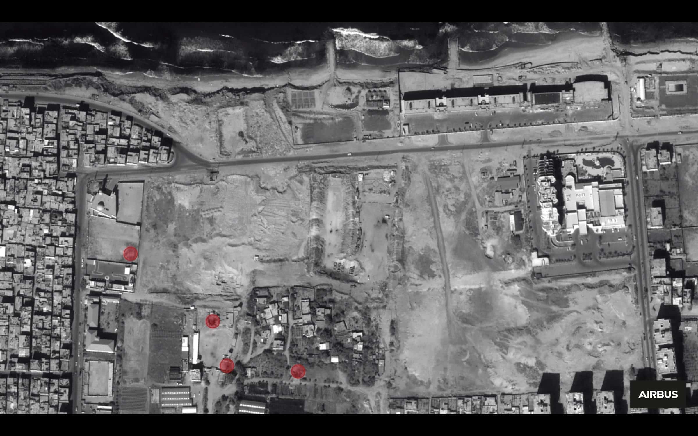 Gaza Arch_Image 12_2012 - Fig. 21 - Analysis of a 2012 satellite image (red circles indicate bomb craters or other evidence of damage). Image: Forensic Architecutre, 2022. Satellite image © CNES 2018 Distribution Airbus DS/Spot Image