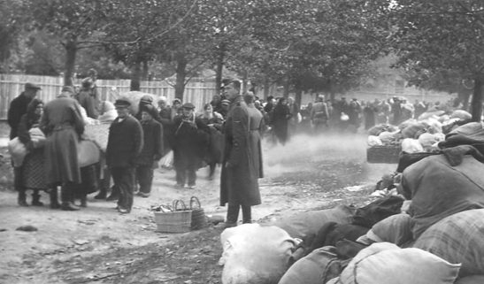 Luggage surrender - Fig. XVI. Surrendered luggage at the intersection of Dorohozhytska and Sim'i Khokhlovykh streets in September 1941. Not for reproduction. (Central State CinePhotoFono Archive of Ukraine)