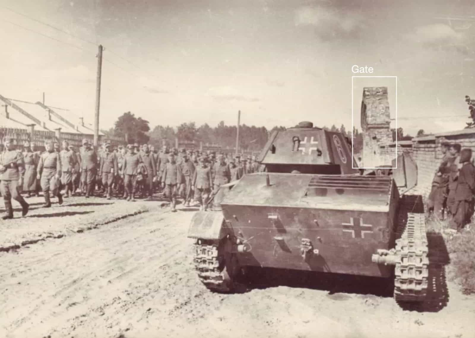 Soviet troops with German captives - Fig. XI. Soviet troops on Illienka Street lead German prisoners of war on 16 August 1944. The same gate (outlined here) is also visible in in CCTV footage of the TV tower strike, allowing FA and the CST to place it within the Babyn Yar site. Original source unknown.