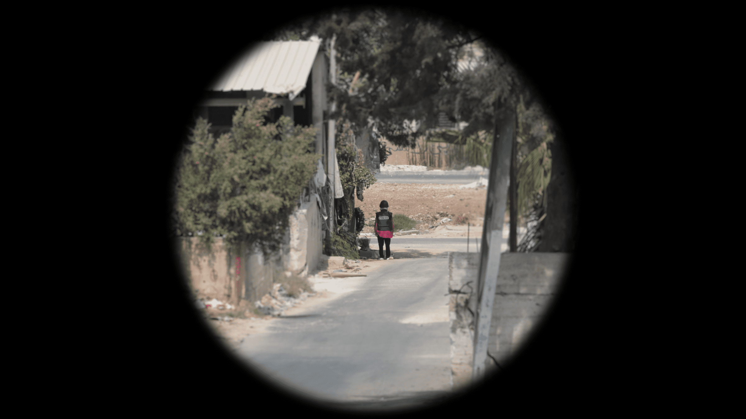 Shireen-Position_Cropped - Optical reconstruction of the visibility of Shireen’s vest at the moment she was shot, as seen from the location of the marksman. Telephoto magnification mimics the effect of the optical scope they most likely used (Trijicon COG x4). (Forensic Architecture and Al-Haq, 2022)