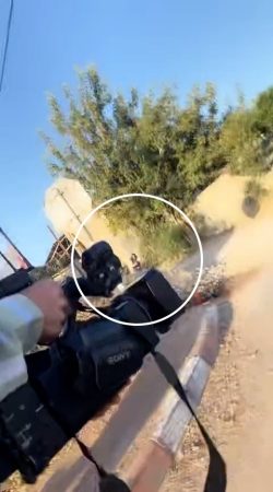 Shireen last seen alive - The last moment Shireen is seen on camera still alive, crouching near the wall, after the first shot in the second round. 

Image source: Salim Awwad, 11 May 2022, analysis and annotation: Forensic Architecture and Al-Haq, 2022