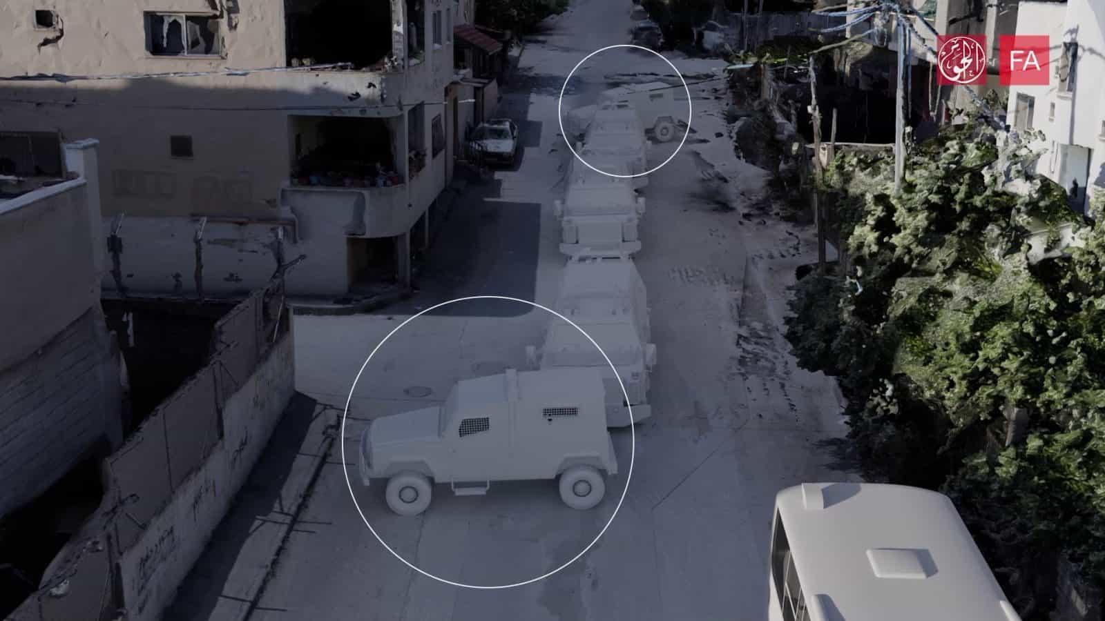 5 Vehicles stationed - Front and back IOF armoured vehicles stationed sideways pointing its shooting hole down the road towards the journalists 190m away