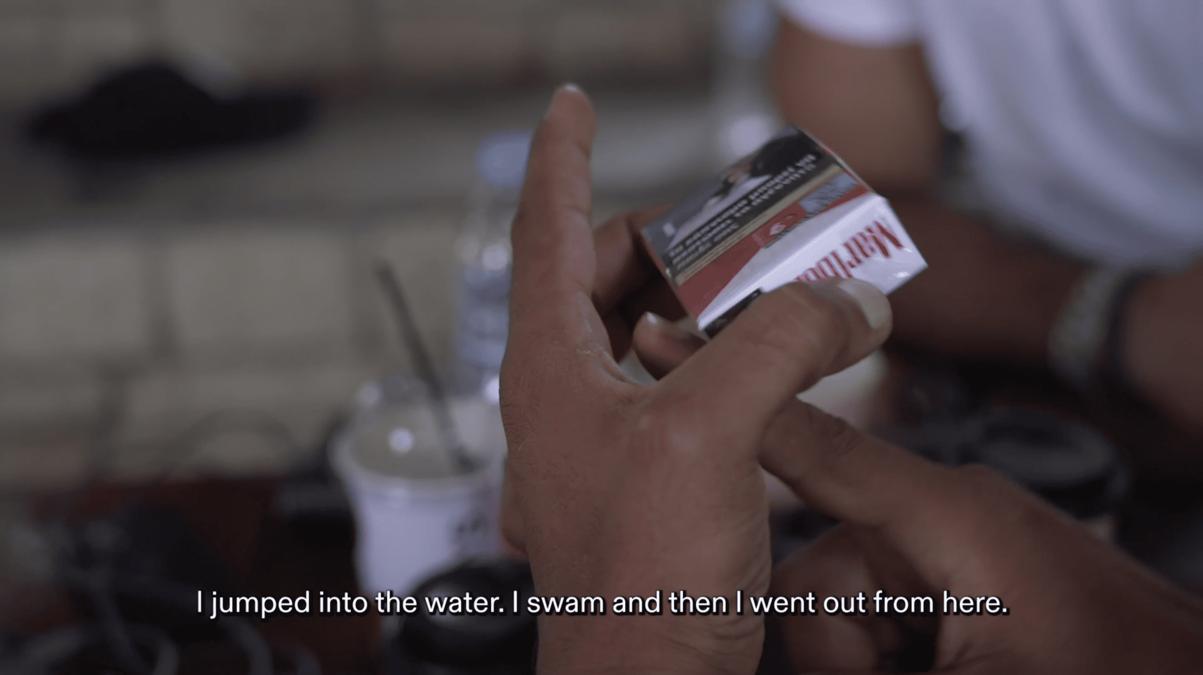 Pack of cigarettes - Survivor using a pack of cigarettes to describe how he swam to the surface underneath the capsizing vessel. (Forensis, 2023)