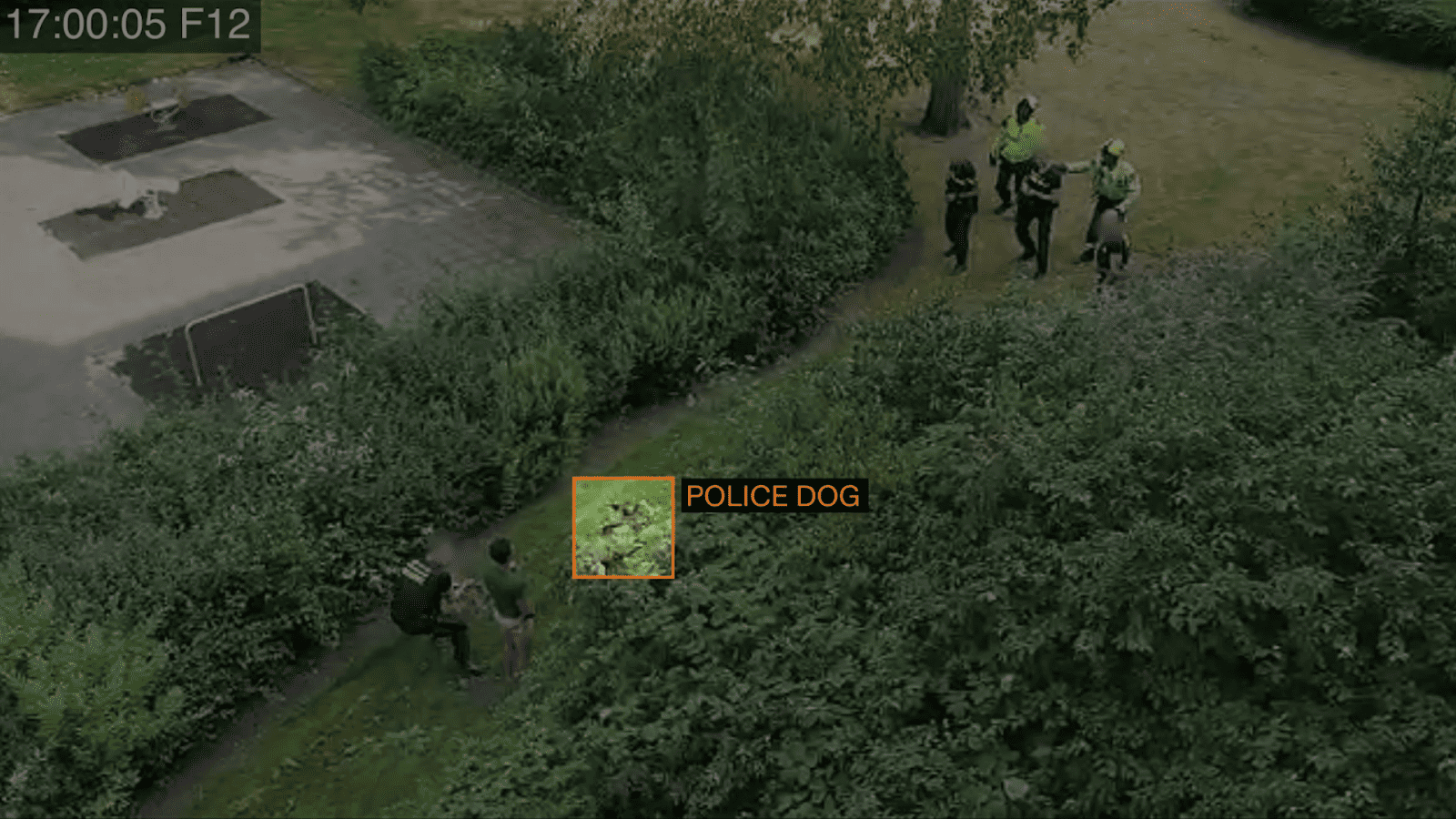 Sammy Baker-4a-Dog runs past Sammy, annotated source video - Sammy was so quiet, and motionless, at this time, that the police dog simply ran right past him, towards the shouting officers on the other side. (Forensic Architecture and Forensis, 2023)