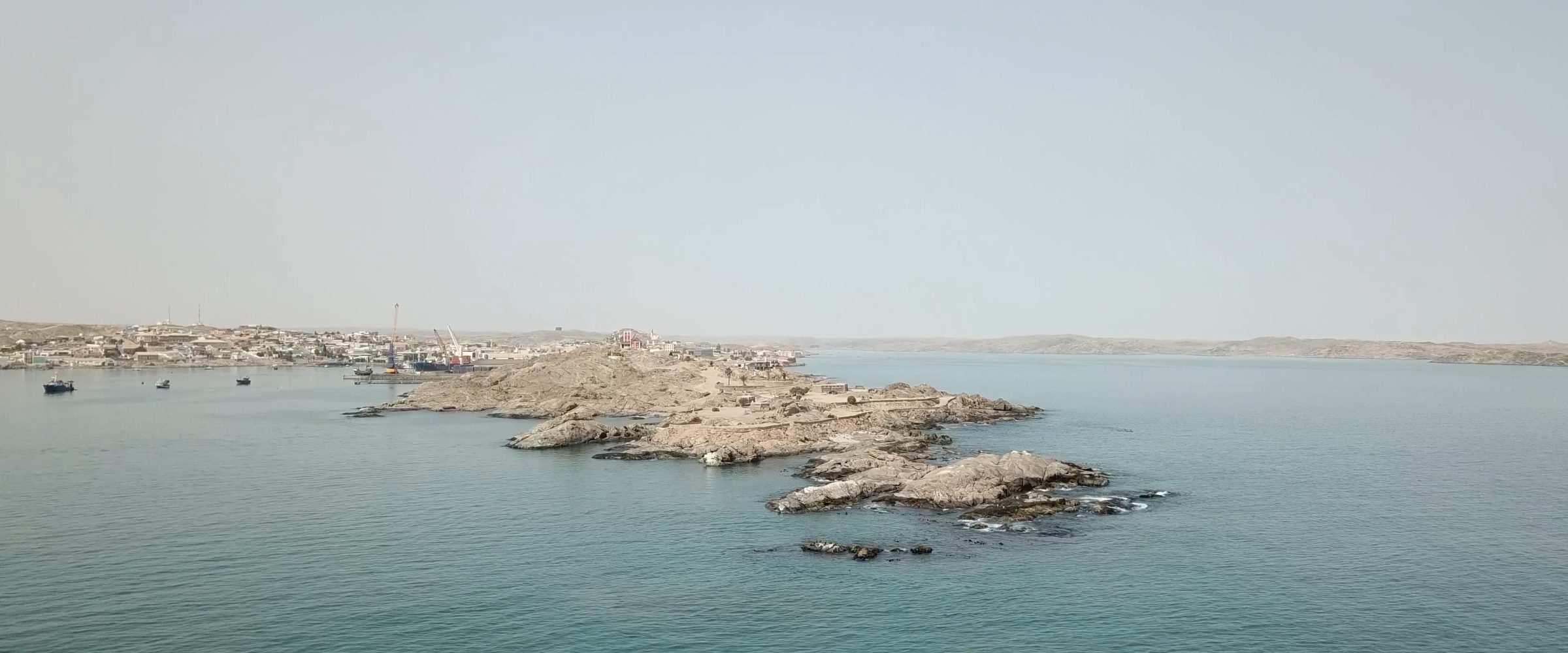 Drone Photograph of Shark Island - Drone photograph of Shark Island seen from northeast. Authorities are planning an expansion of the port, threatening the preservation of Shark Island as a site of contemplation. (Forensic Architecture/Forensis, 2024)