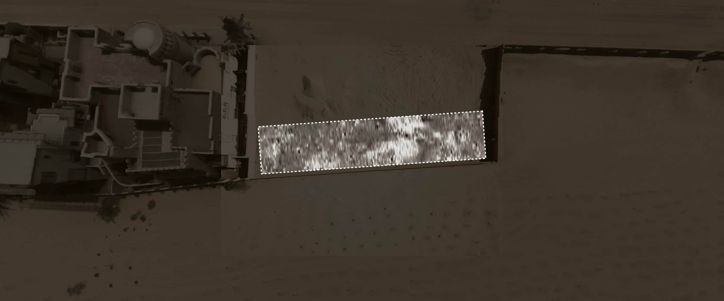 GPR survey of vacant lot - Another GPR survey was conducted on a vacant lot adjacent to the housing development, which falls within the historical boundaries of the burial site. In this area, where no visible surface mounds were observed, three subsurface anomalies were detected which exhibited characteristics similar to those of the graves marked with sand mounds.