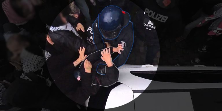 Police Violence Nakba Day 3 - Officer 24111 holds a protester by the head while punching him with his right hand.